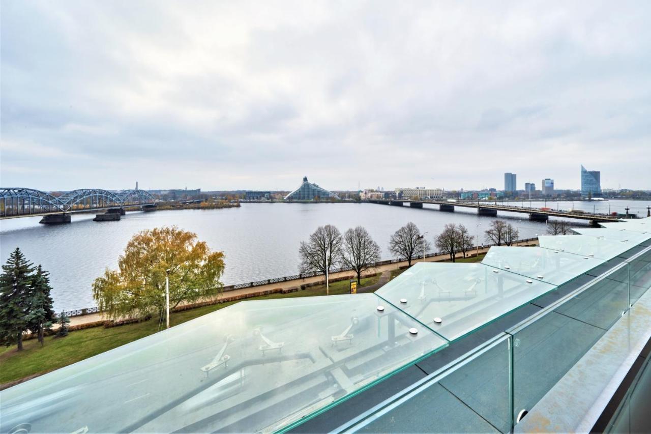 Wellton Riverside Spa Hotel Riga Exterior photo The view of the city from the observation deck of the bridge